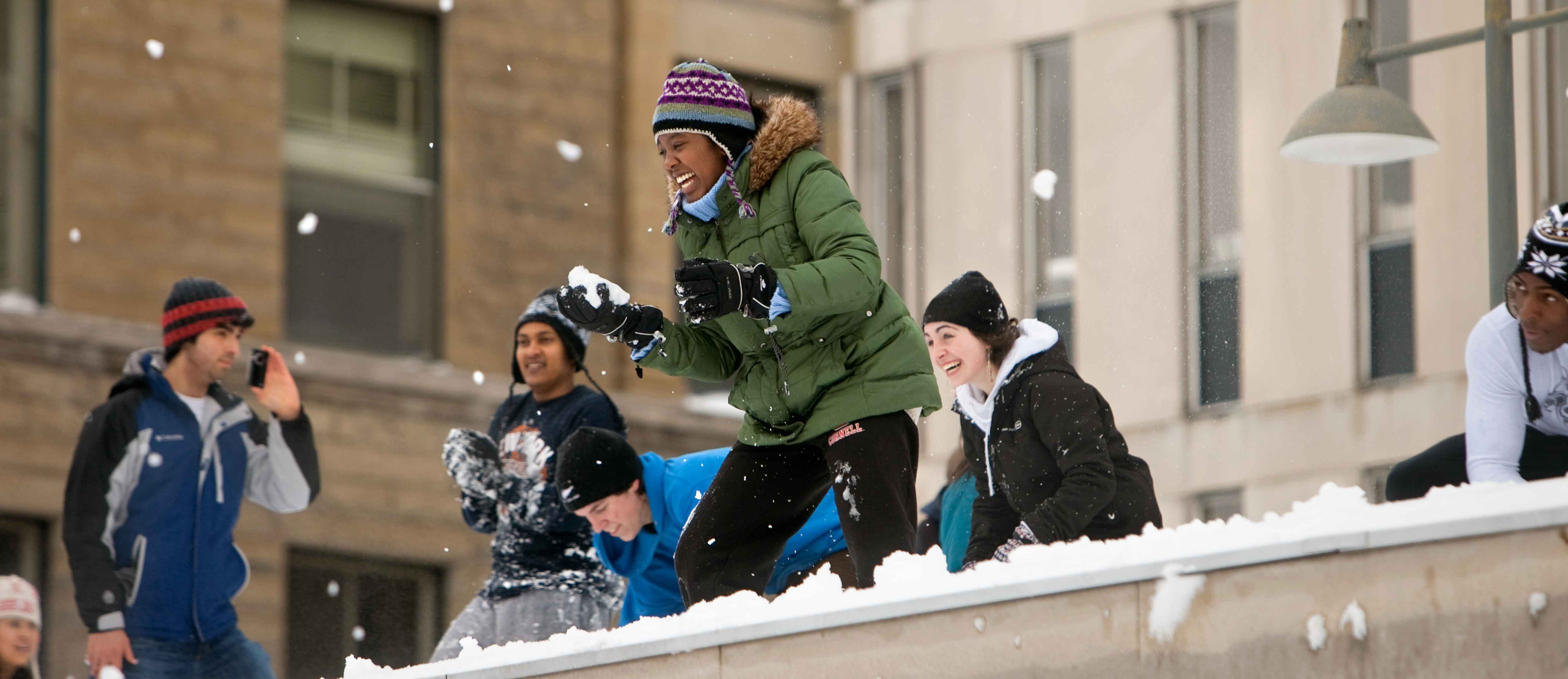 Students toss snowballs on central campus