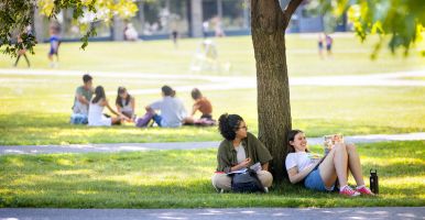 students relax in arts quad