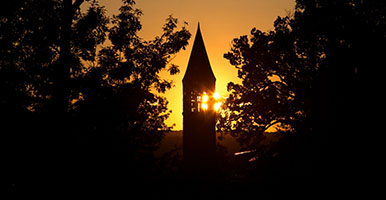 sunset behind clock tower